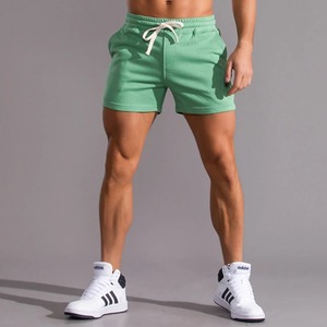 Short de course pour homme en coton et lin avec poches à fermeture à boutons, décontracté pour le printemps, l'été et la musculation - Product Image 1