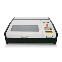 Machine de gravure et de découpe laser CO2 mini JX-4040 - CNC refroidi par eau avec prise en charge DXF/LAS pour le caoutchouc, le bois et le papier