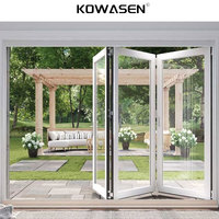 Porte de grange moderne en verre et aluminium pliable invisible pour usage extérieur