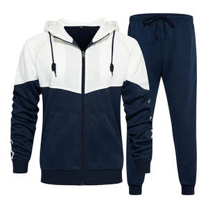 Chándal de hombre de tela suave con puños acanalados con cremallera frontal y pantalones cónicos diseñados para entrenamiento de gimnasia o chándal de viaje - Product Image 1