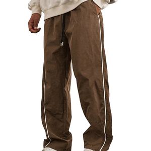 Ventes en gros de coupe-vent personnalisés avec impression d'écriture, streetwear, coupe-vent en nylon évasé, pantalon de survêtement ample pour hommes 2026 - Product Image 1