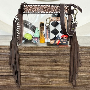 กระเป๋าหนังวัวแท้ลายฉลุแบบใหม่ สไตล์ตะวันตก พร้อมสายสะพายไหล่แบบยาวและพู่ห้อย  วัสดุ PVC ใส สำหรับผู้หญิง - Product Image 1