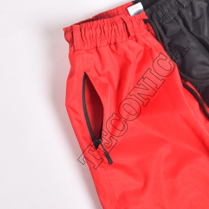 Pantalones de esquí impermeables rojos y negros de dos colores para exteriores Pantalones de snowboard con bucles para cinturón Bolsillos con cremallera y cintura con cordón - Product Image 4