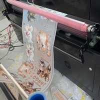 Machine de découpe laser DTF DOWIN 1200x1500mm avec refroidissement par eau pour la découpe de films DTF et d'étiquettes de soin.