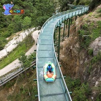 Toboggan aquatique commercial en verre à piste longue pour zones panoramiques, stations de montagne et parcs d'aventure