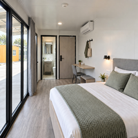 Centre de vente innovant en forme de cabine Apple de 40 pieds – Unité de bureau mobile personnalisée pour l'affichage et la réception immobilière