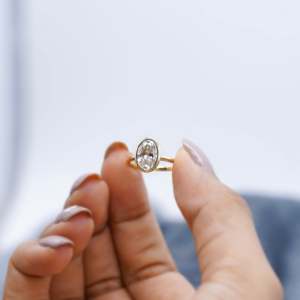Oval Engagement <b>Ring</b> in Yellow Gold with Bezel Set <b>Diamond</b> Elegant <b>Diamond</b> <b>Rings</b> Collection - Product Image 6