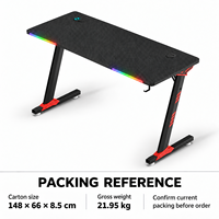 Bureau de jeu noir avec plateau nervuré, accents RGB à l'avant et pieds rouges pour bureaux à domicile, salles d'étude et salles de jeu