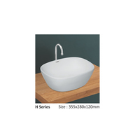Lavabo de salle de bain en céramique blanc de style européen moderne avec plateau en granit, lavabo d'hôtel personnalisé et robinet à capteur