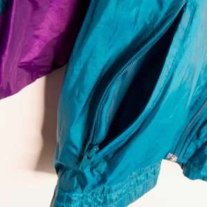 แจ็กเก็ตฤดูใบไม้ผลิสไตล์หลวมกลางๆมีซิปปิดปีกเสื้อกันลมโพลีเอสเตอร์แจ็คเก็ตคอปกตั้ง - Product Image 6