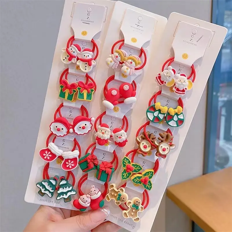 10 unids/set Navidad gomas de los niños dulce Santa Claus muñeco de nieve de banda de goma elástica chicas decoración del pelo