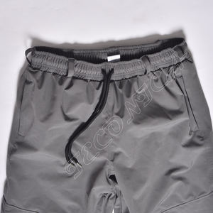 2025 confortable imperméable coupe-vent pantalon taille élastique hommes pantalon couleur unie surdimensionné hommes pantalon ample avec grande poche - Product Image 5