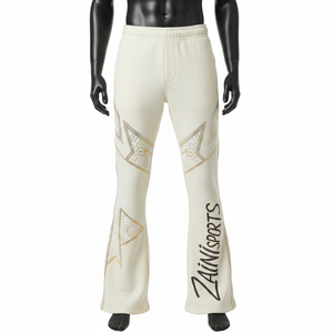 กางเกงทรงบานผ้าโพลีเอสเตอร์ผสมอีลาสเทน พรีเมียม เนื้อผ้านุ่ม ยืดหยุ่น สีไอวอรี่ ดีไซน์แผงตกแต่ง ประดับคริสตัลแบบฮอตฟิกซ์ โลโก้สั่งทำพิเศษ กางเกงทรงบาน - Product Image 1