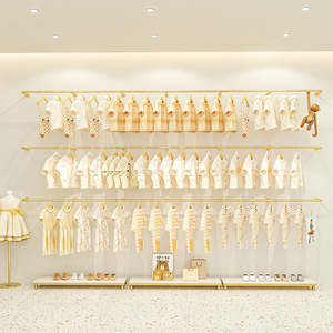 Exhibidor de Ropa Metálico de Pared con Acabado Dorado para Tiendas de Ropa Infantil, Boutiques y Comercios Minoristas, Sistema de Decoración de Pared Profesional - Product Image 1