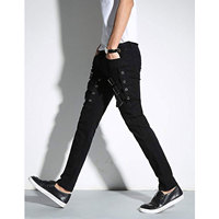 Jean slim noir pour homme style punk avec boucles décoratives, taille mi-haute et fermeture éclair