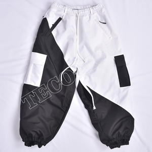 Venta al por mayor OEM pantalones de esquí para Unisex impermeable a prueba de viento transpirable invierno Snowboard alto poliéster Nylon forro duradero bolsillo - Product Image 1