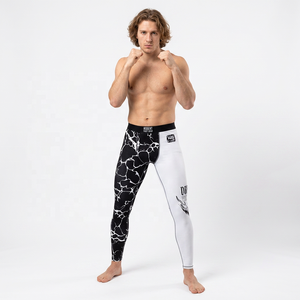 Pantalon de sport pour homme en polyester et élasthanne, coupe ajustée, imprimé par sublimation, motif blanc et noir, pour arts martiaux mixtes - Product Image 1