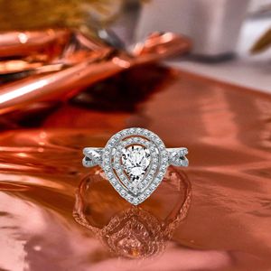 Pear <b>Shape</b> Moissanite - Infinity <b>Twisted</b> Shank - Duo Halo Cluster Engagement Ring - 18K White Gold Plating over Silver - Product Image 1
