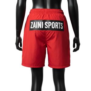 Shorts cortavientos para mujer, tela suave de poliéster tejido, secado rápido, paneles rojos y negros, logo impreso con calor. - Product Image 2