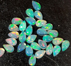 Pera de ópalo etíope natural Cabujón de 4x6mm Parte posterior plana-Excelente calidad Multifire Opal Pear Cabochon Gemstone - Product Image 4
