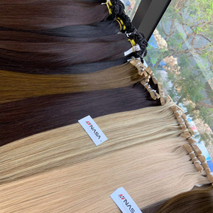 Extensions de cheveux vierges vietnamiens de haute qualité, foncés et blonds, à fixer avec des bandes, style ondulé naturel, approvisionnement direct d'usine - Product Image 1
