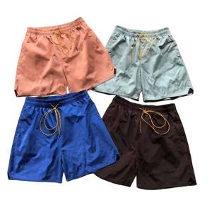 กางเกงขาสั้นผ้าไนลอนสีดำสำหรับผู้ชายกางเกงออกกำลังเล่นกีฬายิมสไตล์สตรีทผ้าโพลีเอสเตอร์ชายหาดออกแบบได้ตามต้องการ - Product Image 1