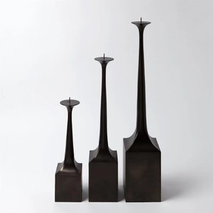 Candlestick <b>Holder</b> features a sleek and modern design constructed from cast <b>bronze</b> with a dark brown <b>Holder</b> Modern - Product Image 1