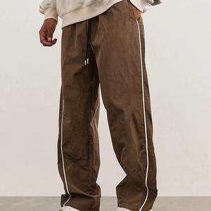 กางเกงวอร์มกีฬาคุณภาพสูงแบบสั่งทำพิเศษ ทรงโอเวอร์ไซส์ แต่งแถบสะท้อนแสง กันลม ผลิตจากไนลอนและโพลีเอสเตอร์ สำหรับผู้ชาย - Product Image 1