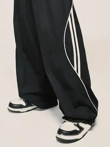 Nuevos pantalones cortavientos transpirables a rayas laterales para hombre, pantalones de secado rápido de verano informales para correr, pierna ancha con cordón, ligeros y holgados - Product Image 3