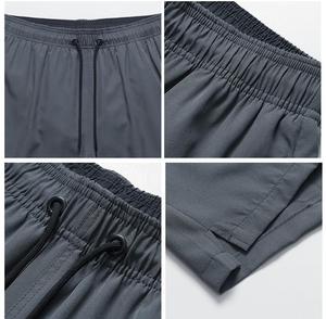 Short athlétique pour hommes de couleur unie avec poches en mélange de polyester spandex extensible et respirant à séchage rapide vente en gros - Product Image 2