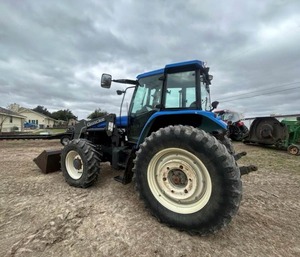 TRACTOR USADO COMO NUEVO HOLAND TM125 1051 con Cargador Autonivelante 72LA y Cucharón de Acoplamiento Rápido de 96 Pulgadas con Garra - Product Image 5