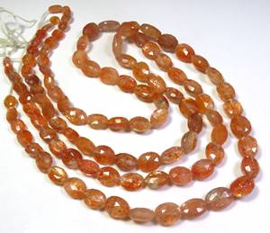 ลูกปัดพลอยซันสโตนธรรมชาติคุณภาพสูง ขนาด 18 นิ้ว รูปทรงรีเหลี่ยมเพชรพลอย สีส้ม ขนาด 6-12 มม. ความเงางามสูง แบบไดโครอิก พลอยแอฟริกัน แบบเม็ดเดี่ยว - Product Image 5