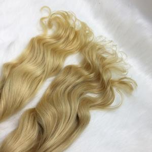 Extensiones de cabello de materia prima humana ondulada natural HD cinta normal cabello vietnamita rubio claro de alta calidad al por mayor - Product Image 4