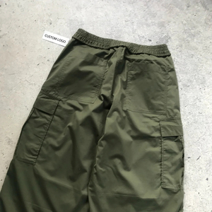 Pantalon coupe-vent unisexe décontracté, écologique, en polyester/nylon non tissé, à bas large et épais, poids moyen, coupe régulière - Product Image 6