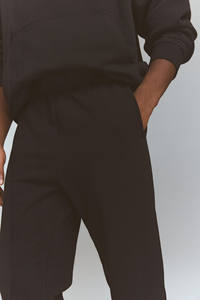 Fitness al aire libre sueltos de secado rápido pantalones transpirables Streetwear en blanco hombres Pantalones deportivos Casual moda Color sólido Jogger Pantalones - Product Image 5