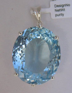 Colgante de Oro Blanco con Topacio Azul Cielo, Joyería Religiosa Hecha a Mano con un Patrón de Cruz y Diamantes, Chapado en Rodio - Product Image 1