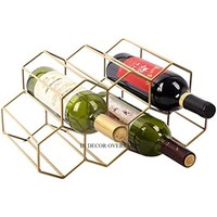 Base polie brillante argentée et feuilles plaquées or de haute qualité et support de support de bouteille de vin d'aspect attrayant de concepteur de grenade