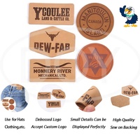 Étiquettes de vêtements en jean fabricant Logo personnalisé en relief patchs en cuir véritable pour chapeaux