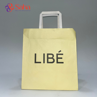 Sacs en papier kraft biodégradables recyclables en gros avec poignée pour emballage de vêtements et artisanat, pelliculage mat, logo personnalisé