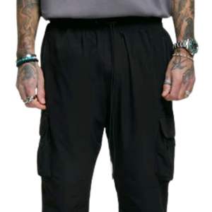 Pantalon Cargo noir Streetwear moderne poignets de cheville réglables taille élastique tissu Durable poches zippées cachées coupe élégante - Product Image 6