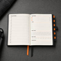 Carnet de planification de fitness LABON personnalisé A5 avec onglets 12 mois, couverture en PU noir, logo argenté, journal de suivi des habitudes et entraînements quotidiens