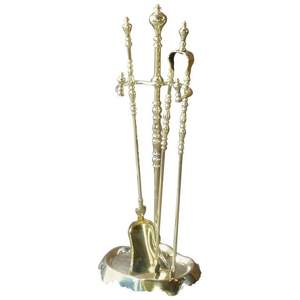 Brass fire tool set with elevated rack and burnished shine designed for both practical fire <b>care</b> and vintage charm - Product Image 3