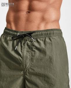 Shorts de sport pour homme, design tendance, décontractés, pour la course à pied, l'entraînement, taille mi-haute élastique, polyester et coton, motif uni, entraînement sportif pour homme - Product Image 6