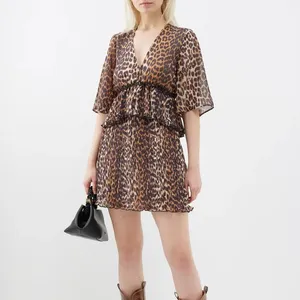 Brown leopard-print chiffon mini dress is cut with a deep V-neckline before transitioning into a softly pleated skirt