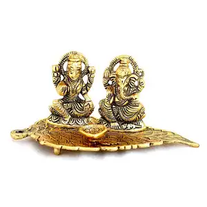 Pirinç ev dekor Metal Lord Ganesha ve Lakshmi Patta yaprak Showpiece üzerinde Hindu dini idoller Murti pirinç süslemeleri ev için