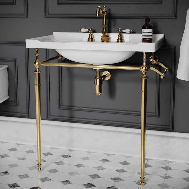 Decorative brass wash basin stand with intricate design for vintage-inspired bathroom renovation and styling needs