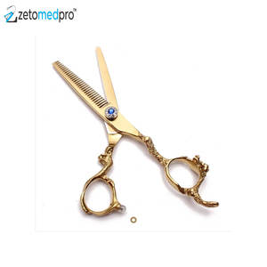 กรรไกรตัดผม Zetomedpro Precision Salon รุ่นเคลือบทอง ใบมีดสแตนเลสสตีลสีน้ำเงินประดับอัญมณี ฟันละเอียด สำหรับช่างทำผม - Product Image 1
