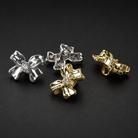 Bouton décoratif de luxe en alliage métallique avec nœud en strass pour manteau, trench, pull, tricot, accessoires vestimentaires