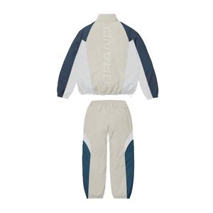 Survêtement unisexe en nylon 100% avec étiquette personnalisée survêtement de sport d'hiver avec taille élastique pantalon de survêtement ensemble de vestes coupe-vent - Product Image 1