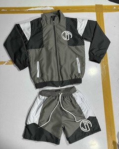 Fabricants de vêtements tendance : Ensemble survêtement deux pièces pour homme, veste zippée en polyester et pantalon de jogging en nylon coupe-vent - Product Image 1